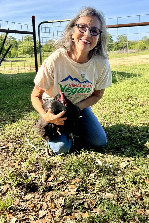 Renee King-Sonnen with Penelope, one of Rowdy Girl's avian residents.