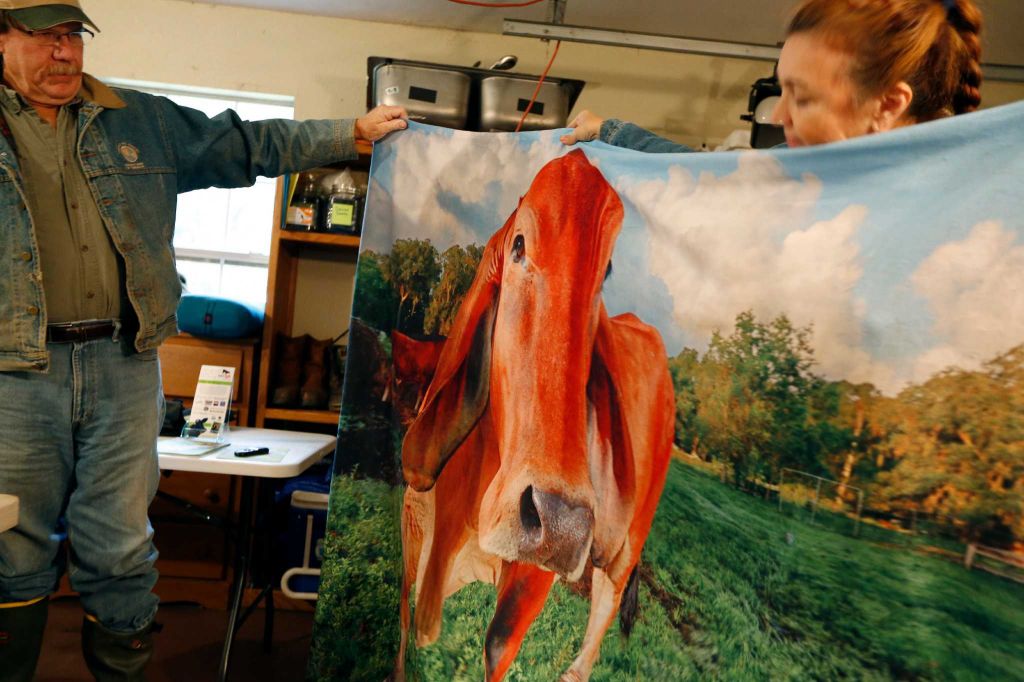 Houston Chronicle Story-23 Tommy and Renee hold up Cinnamon blanket