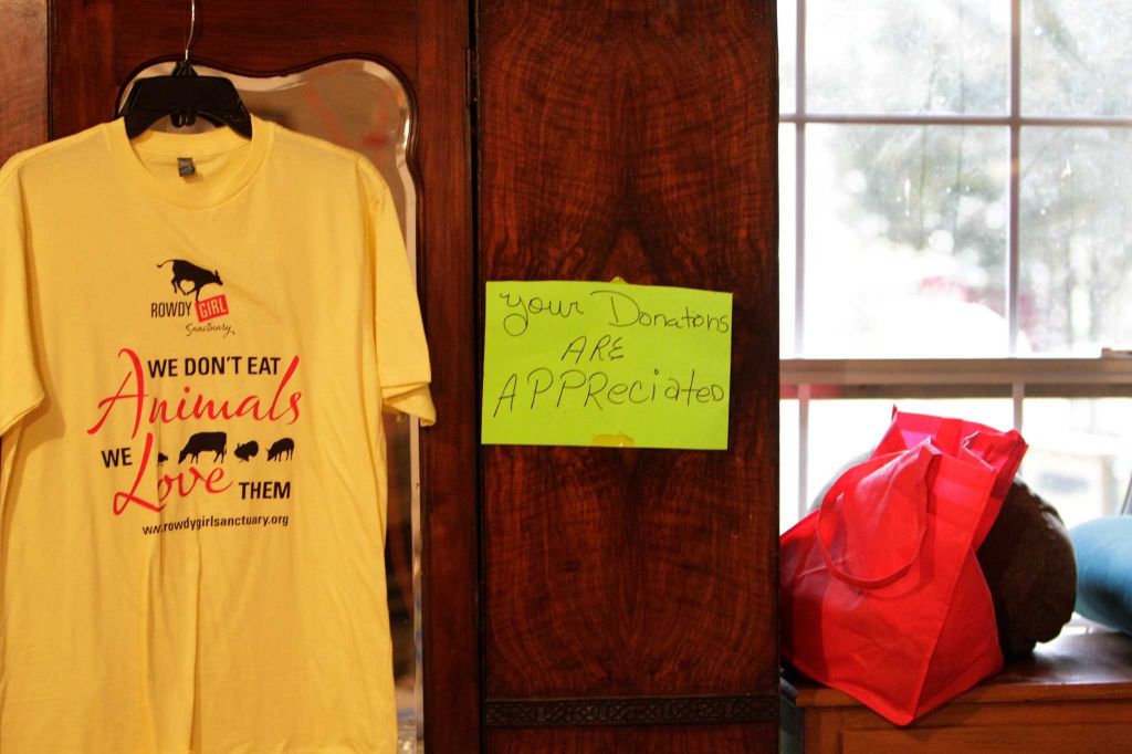 Houston Chronicle Story-3 We don't eat Animals we Love them tshirt hanging on wall