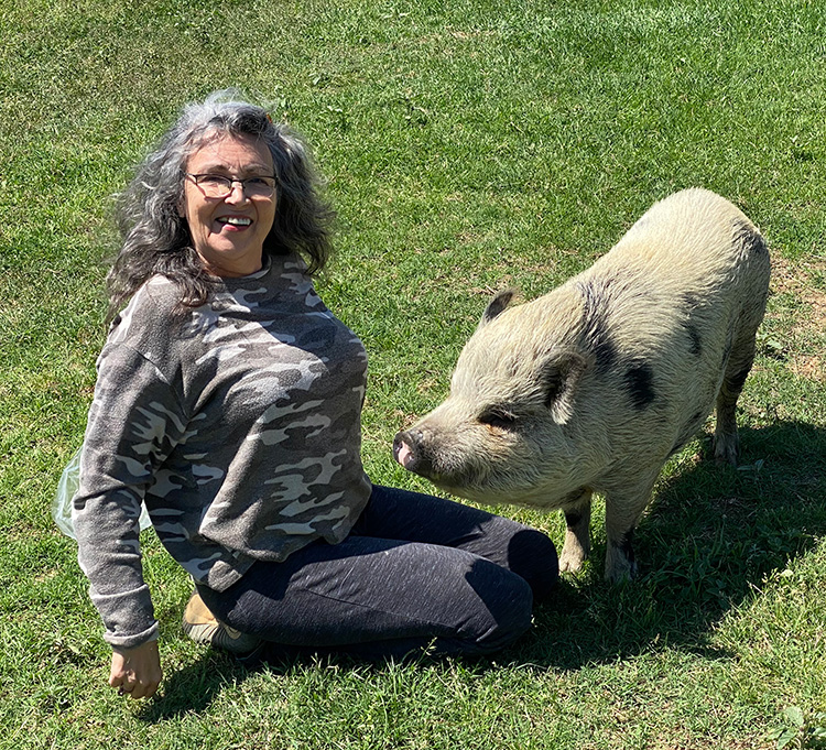 Lulu and Renee. Lulu is one of our pig residents. She was surrendered by a family who wanted her to live her best life.