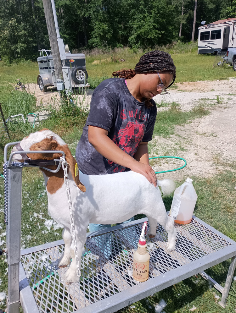 Symone giving Sayter a bath