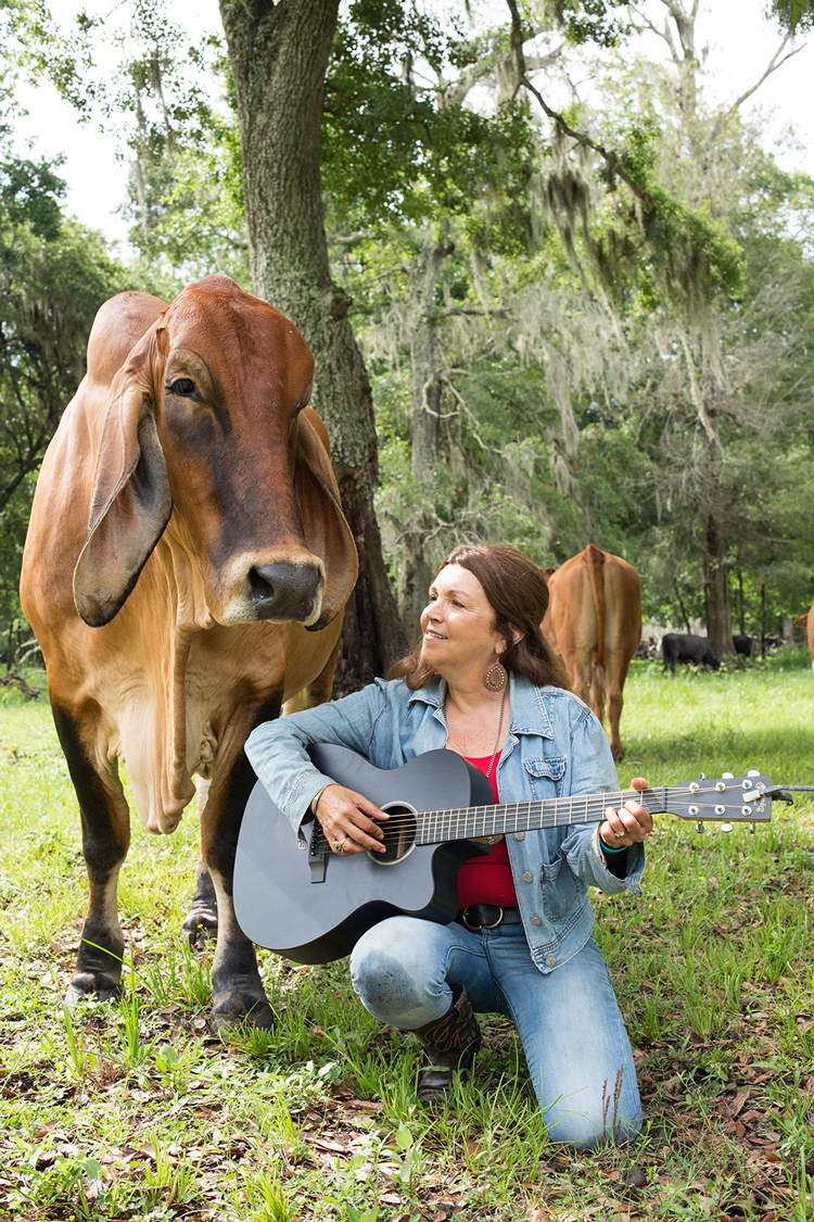 Renee with guitar singing to Cinnamon