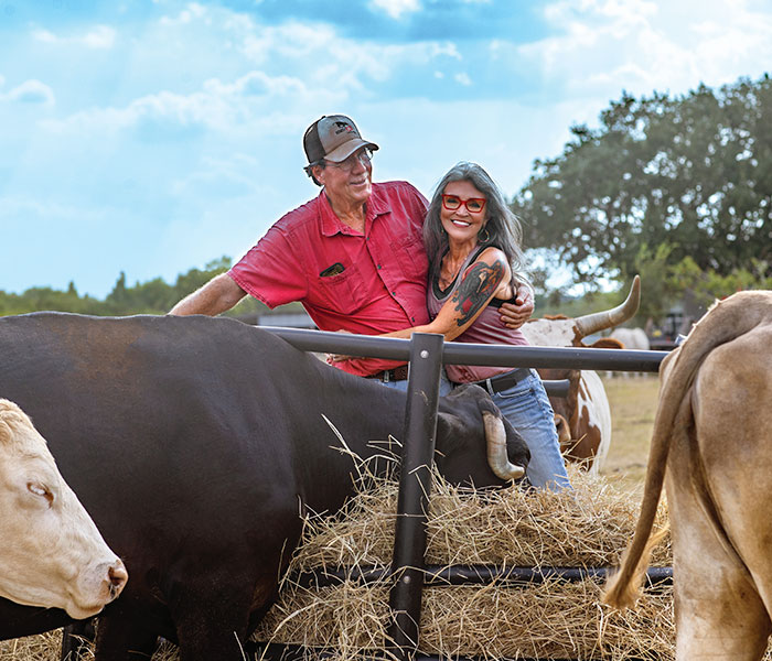 Texas-Woman-Nearly-Got-Divorced-Over-Veganism-But-Ended-Up-Buying-Her-Husbands-Cattle-Farm-To-Turn-It-Into-An-Animal-Shelter-6a73a3abdcb67__700 Tommy and Renee in hay with cows